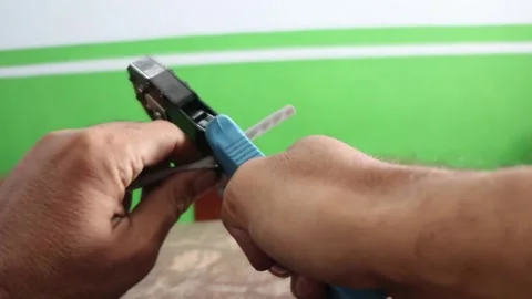 Strip the skin of a network cable. Strip the UTP cable Stock Footage 287525672