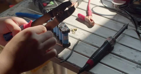 Strip the wires using a specialized tool. Stock Footage 277843310