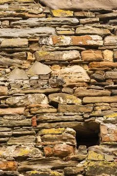 Striped and rectangular stone wall pattern, texture. Vertical photo. background Stock Photos