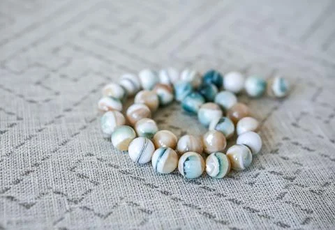 Striped beads on a string with selective focus Stock Photos