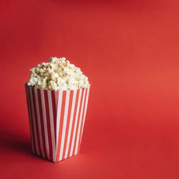 Striped box with popcorn Stock Photos
