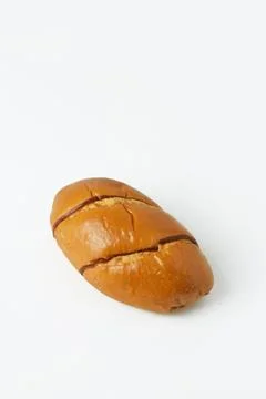 Striped brown bread on a white background Stock Photos
