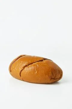 Striped brown bread on a white background Stock Photos