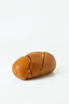 Striped brown bread on a white background Stock Photos
