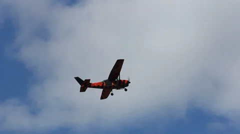 Striped Cessna flying Stock Footage 27876963