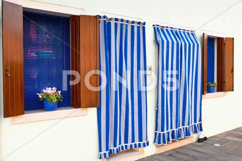 Striped curtains and white walls Stock Photos