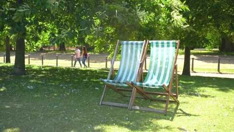 Striped Deck Chairs in Park Stock Footage 96693004