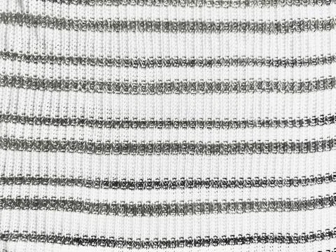 Striped knit fabric texture features minimal white and grey woven wool yarn p Fotos de archivo