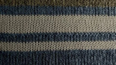 Striped knit wool macro texture closeup in cozy navy beige olive evoking auth Stock Photos
