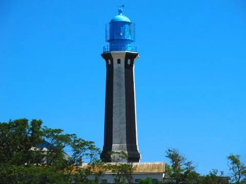 Striped lighthouse. Stock Photos