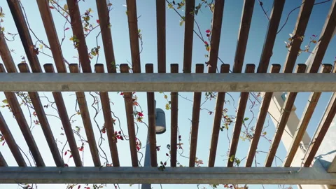 Striped metal construction frame being covered parking lot protecting vehicles Stock-Footage 303658099