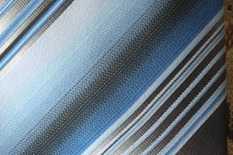 A striped silky textile with diagonal pattern Stock Photos