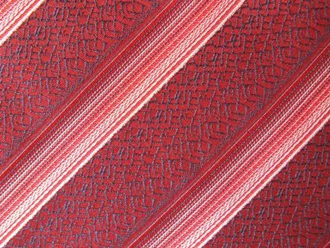 A striped silky textile with diagonal pattern Stock Photos