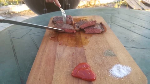 Striped steak. Roasting medium/medium well. Lay out the steak on a wooden Board Stock Footage 140185644