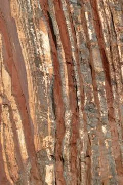 Striped stone texture. Minerals. Abstract vertical background pattern. Stock Photos