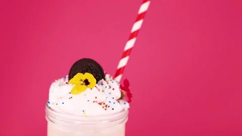Striped Straw Falls Into Whipped Cream Milkshake Dessert Stock Footage 323148106