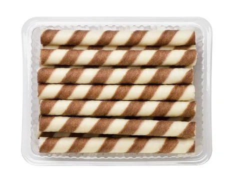 Striped wafer rolls in a package close-up on a white. Top view Stock Photos