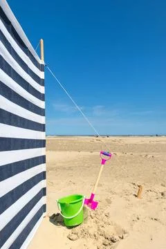 Striped windbreak at the beach Striped wind break at the beach Copyright: ... Stock Photos