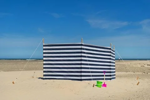Striped windbreak at the beach Striped wind break at the beach Copyright: ... Stock Photos