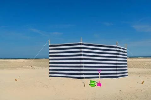 Striped windbreak at the beach Striped wind break at the beach Copyright: ... Stock Photos