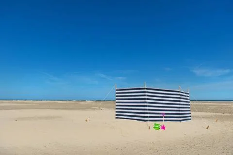 Striped windbreak at the beach Striped wind break at the beach Copyright: ... Stock Photos