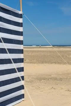 Striped windbreak at the beach Striped wind break at the beach Copyright: ... Stock Photos