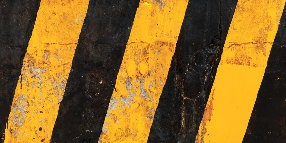 Striped yellow black caution pattern Stockfoto's
