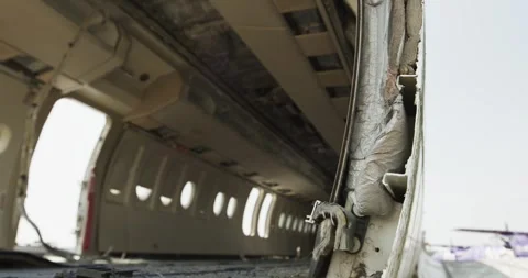 Stripped Cabin Inside Decommissioned Airplane, Empty Window Row, Wide Shot Stock Footage 340304349
