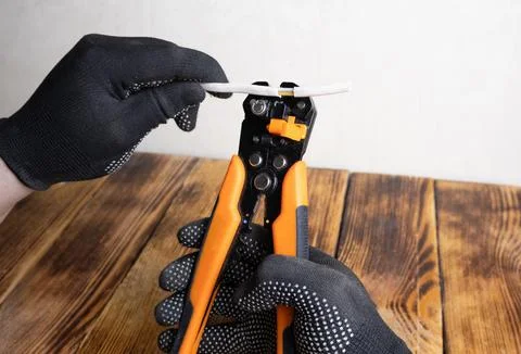 A stripper for stripping wires. A tool for an auto electrician. Stock Photos