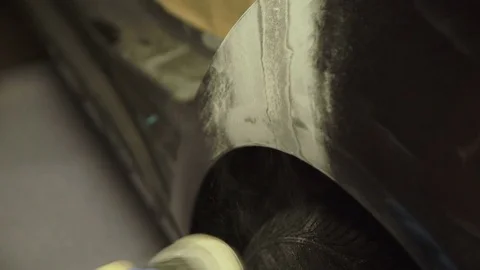 Stripping the car with a grinding machine. 4K Video stock 78447373
