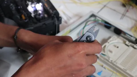 Stripping the fiber optic cable Stock Footage 343328739