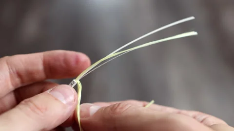 Stripping an optical fiber cable to expose internal layers Stockbeeldmateriaal 312358689