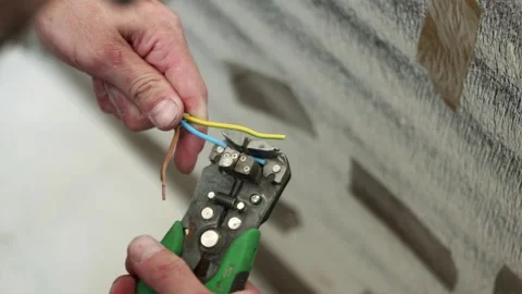 Stripping outer insulation from electrical power cable close up Stock Footage 339298365