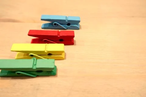 Strips multi-colored cloth placed on a wooden table. Stock Photos