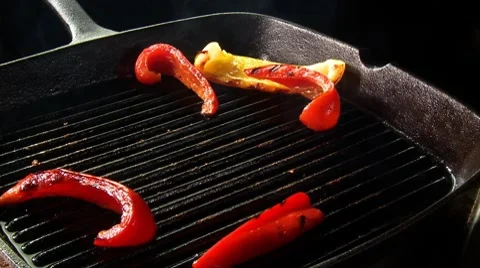 Strips of red pepper and steak in a grill frying pan Stock Footage 8572172