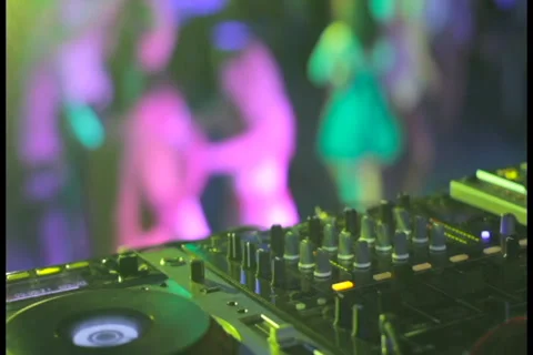 Strobe light, night club audio engineer controls levels dancing Stock Footage 27363848