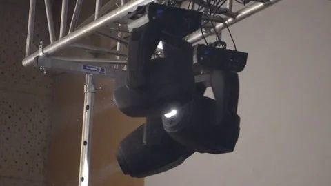 Strobe lights emitting different color beams hanging under the ceiling Stock Footage 80478527