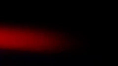 Strobe streaks of light leaks from flashing lights on left of frame Stock Footage 245271233