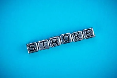 Stroke disease background concept with cubic metal letters Stock Photos