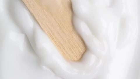 Stroking white cream over white surface, rotating. Swatch face cream. Hydra.. Stock Footage 271130208