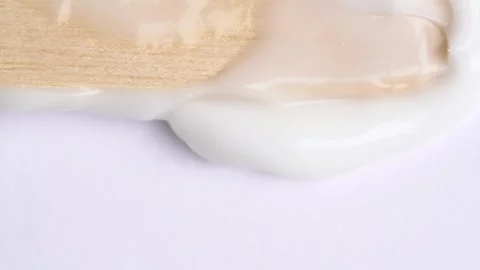 Stroking white cream over white surface, rotating. Swatch face cream. Hydra.. Stock Footage 271130335