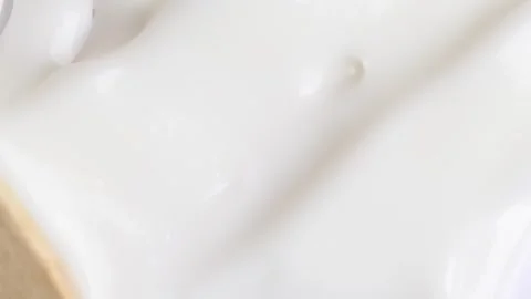 Stroking white cream over white surface, rotating. Swatch face cream. Hydra.. Stock Footage 274070111