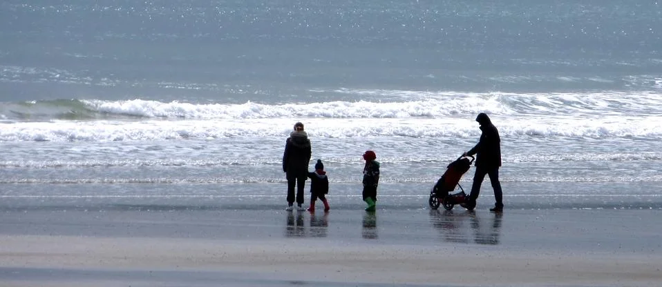 A stroll on the beach Stock Photos