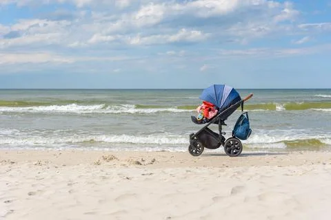 Stroller on the beach Stock Photos