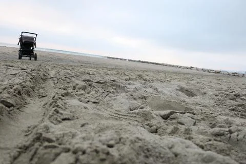 Stroller on the beach Stock Photos