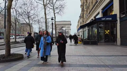 Strolling along Champs-Élysées with view of Arc de Triomphe, Paris, France. FPV Stock Footage 303568846