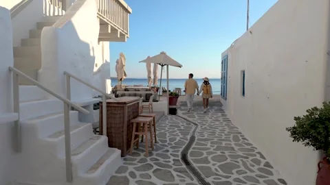 Strolling along the charming pathways of Paros Greece with stunning sea views Stock Footage 336530818