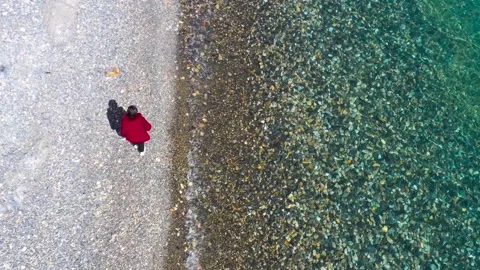 Strolling on the beach, the lake is clear Stock Footage 243071253