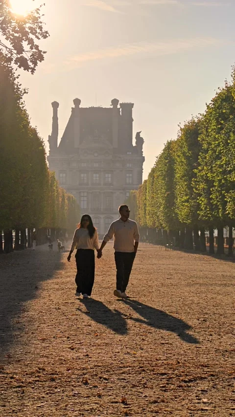 Strolling hand in hand through the enchanting Tuileries Garden in Paris Stock-Footage 347940264