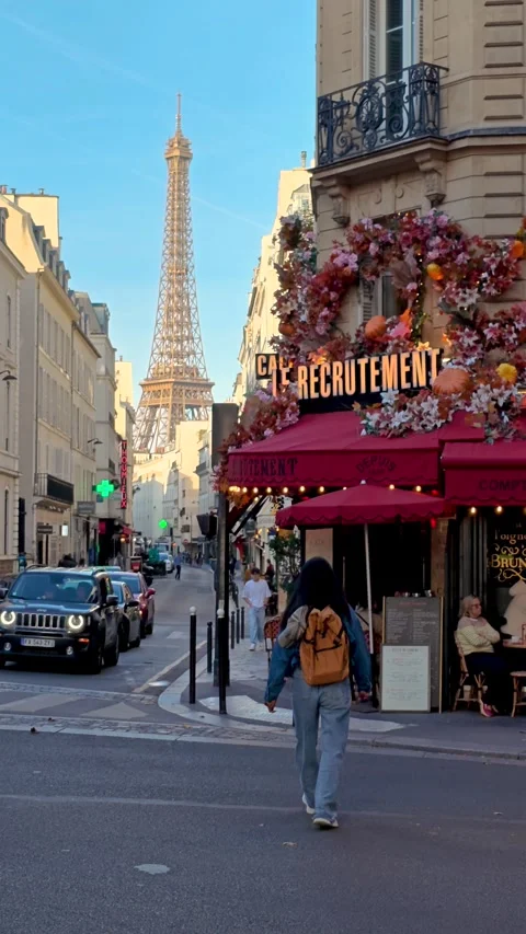Strolling through the charming streets of Paris with the Eiffel Tower in view Stock Footage 347260802